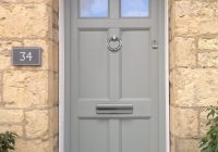 A grey/green residential front door.