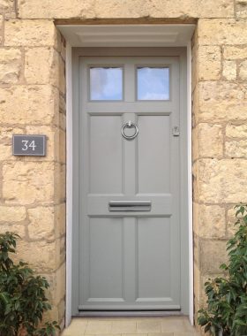 A grey/green residential front door.