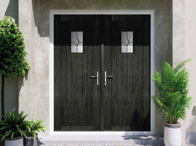 Black French composite doors opening into a home