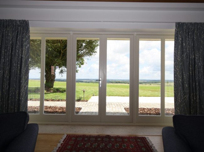White timber French doors leading to outdoor patio